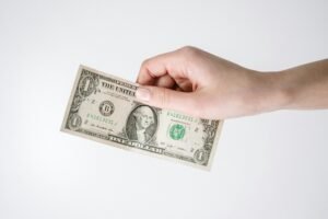 Implement dollar-cost averaging to minimize risk and build wealth through consistent investing