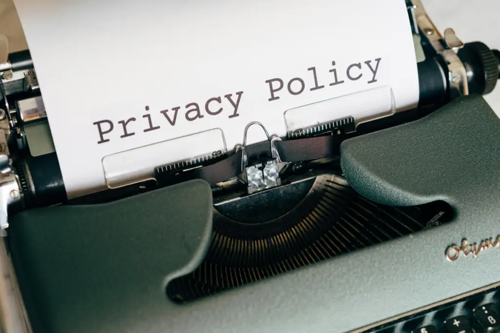 Privacy Policy page banner showing a shield icon symbolizing data security and user privacy compliance.